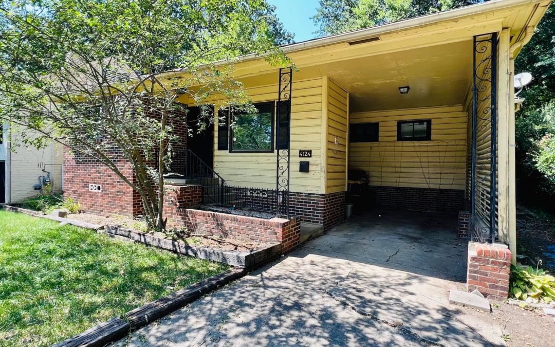 3-bedroom home exterior in Hillcrest, Little Rock, featuring a yellow facade with brick accents, front porch, and landscaped yard.