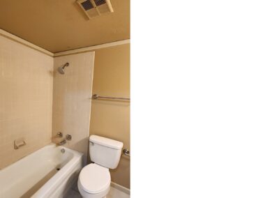 Bathroom featuring a bathtub, toilet, and shower, showcasing updated fixtures in a first-floor condo in West Little Rock.