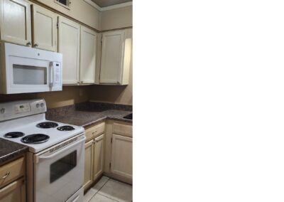 Updated kitchen in first-floor condo, featuring white appliances, granite countertops, and ample cabinetry, located in Pleasant Woods, West Little Rock.