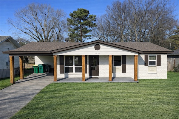 Fully renovated single-family home in Midtown Little Rock featuring a modern facade, covered porch, and landscaped yard.